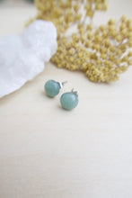 Load image into Gallery viewer, Side view of a pair of sage green aventurine earrings sset on surgical steel posts 