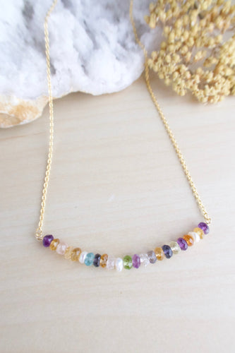 Colorful gemstone bar necklace on a gold chain 