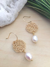Load image into Gallery viewer, Top view of Round gold filigree disc earrings with a white freshwater pearl drop and on 14k gold fill ear wires 