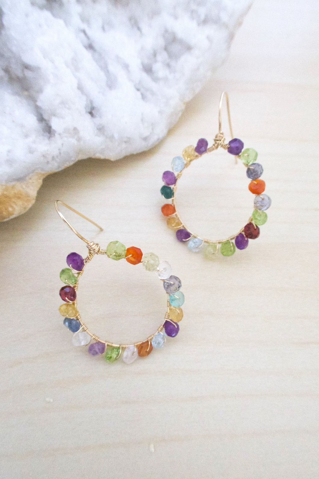 Hoop earrings with multi colored faceted gemstones