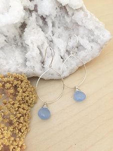 Sterling silver hoop earrings with a light blue chalcedony gemstone drop