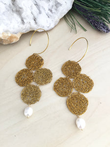 Raw brass wire crochet earrings with a hoop style ear wire and a white freshwter pearl drop 