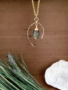 Labradorite gemstone drop necklace enclosed in a wish bone shaped frame 