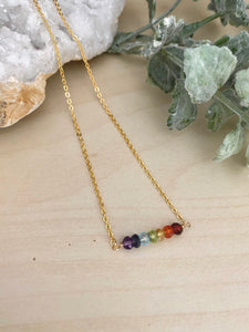 Gemstone bar necklace arranged in the colors of the rainbow. 